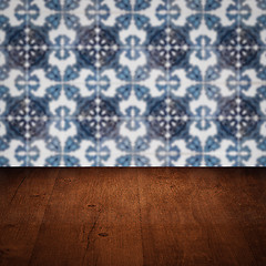 Image showing Wood table top and blur vintage ceramic tile pattern wall