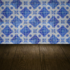 Image showing Wood table top and blur vintage ceramic tile pattern wall