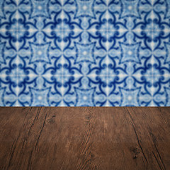 Image showing Wood table top and blur vintage ceramic tile pattern wall