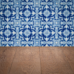 Image showing Wood table top and blur vintage ceramic tile pattern wall