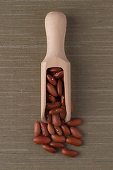 Image showing Wooden scoop with red beans