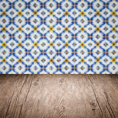 Image showing Wood table top and blur vintage ceramic tile pattern wall