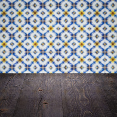 Image showing Wood table top and blur vintage ceramic tile pattern wall