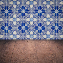 Image showing Wood table top and blur vintage ceramic tile pattern wall