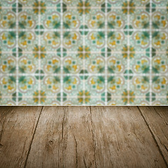 Image showing Wood table top and blur vintage ceramic tile pattern wall