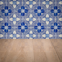 Image showing Wood table top and blur vintage ceramic tile pattern wall