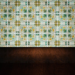 Image showing Wood table top and blur vintage ceramic tile pattern wall