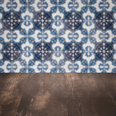 Image showing Wood table top and blur vintage ceramic tile pattern wall