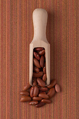 Image showing Wooden scoop with red beans