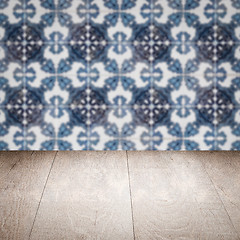 Image showing Wood table top and blur vintage ceramic tile pattern wall