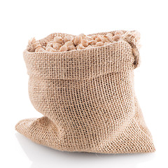 Image showing Uncooked chickpeas on burlap bag