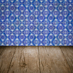 Image showing Wood table top and blur vintage ceramic tile pattern wall