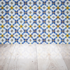 Image showing Wood table top and blur vintage ceramic tile pattern wall