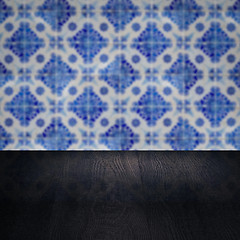 Image showing Wood table top and blur vintage ceramic tile pattern wall