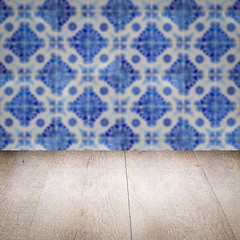 Image showing Wood table top and blur vintage ceramic tile pattern wall