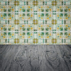 Image showing Wood table top and blur vintage ceramic tile pattern wall