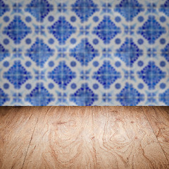 Image showing Wood table top and blur vintage ceramic tile pattern wall