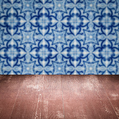 Image showing Wood table top and blur vintage ceramic tile pattern wall