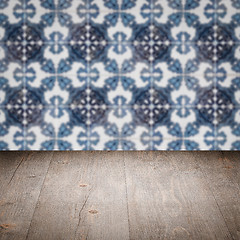 Image showing Wood table top and blur vintage ceramic tile pattern wall