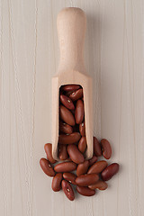 Image showing Wooden scoop with red beans