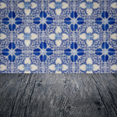 Image showing Wood table top and blur vintage ceramic tile pattern wall