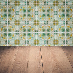 Image showing Wood table top and blur vintage ceramic tile pattern wall