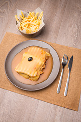 Image showing Francesinha and french fries