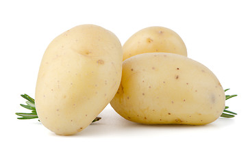 Image showing New potatoes and green herbs