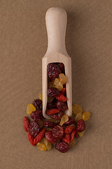 Image showing Wooden scoop with mixed dried fruits