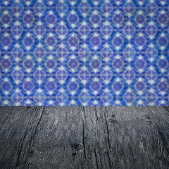 Image showing Wood table top and blur vintage ceramic tile pattern wall