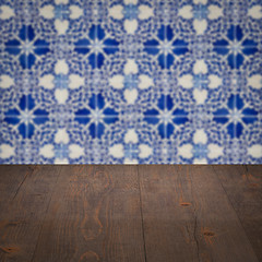 Image showing Wood table top and blur vintage ceramic tile pattern wall