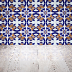 Image showing Wood table top and blur vintage ceramic tile pattern wall