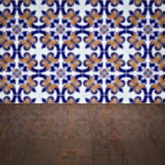 Image showing Wood table top and blur vintage ceramic tile pattern wall