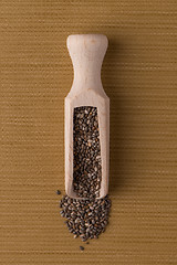 Image showing Wooden scoop with chia seeds