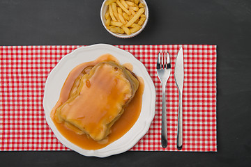 Image showing Francesinha and french fries