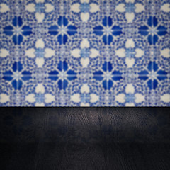 Image showing Wood table top and blur vintage ceramic tile pattern wall