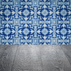 Image showing Wood table top and blur vintage ceramic tile pattern wall