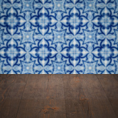 Image showing Wood table top and blur vintage ceramic tile pattern wall