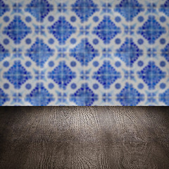 Image showing Wood table top and blur vintage ceramic tile pattern wall