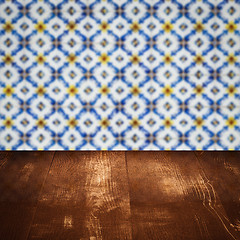 Image showing Wood table top and blur vintage ceramic tile pattern wall