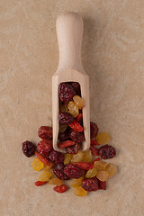 Image showing Wooden scoop with mixed dried fruits