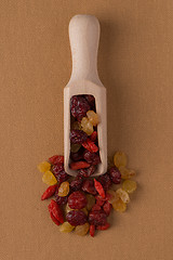 Image showing Wooden scoop with mixed dried fruits