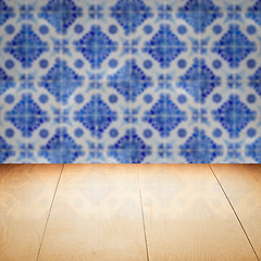 Image showing Wood table top and blur vintage ceramic tile pattern wall