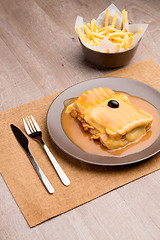 Image showing Francesinha and french fries