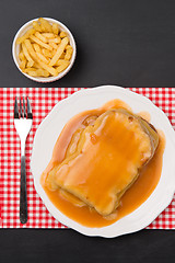 Image showing Francesinha and french fries