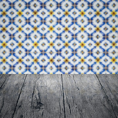 Image showing Wood table top and blur vintage ceramic tile pattern wall