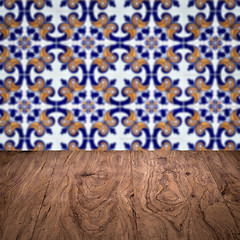 Image showing Wood table top and blur vintage ceramic tile pattern wall