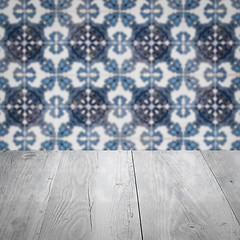 Image showing Wood table top and blur vintage ceramic tile pattern wall