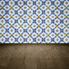 Image showing Wood table top and blur vintage ceramic tile pattern wall