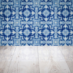 Image showing Wood table top and blur vintage ceramic tile pattern wall